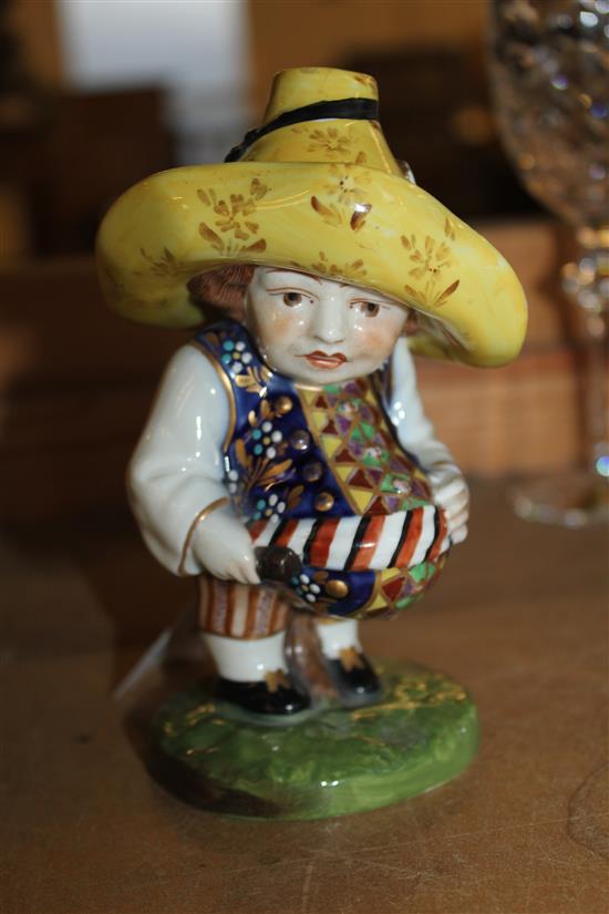 A Continental porcelain model of a Mansion House dwarf, after the Derby original, 14cm